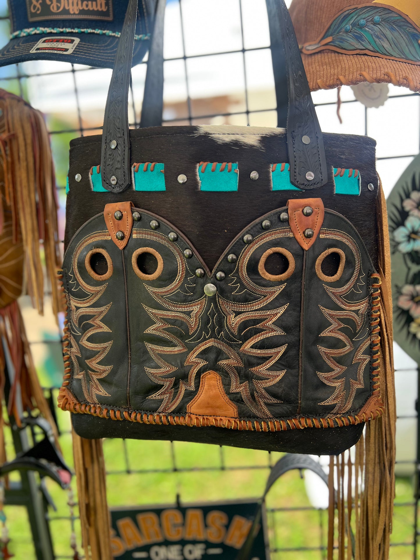 Cow hide tote with boot top pocket